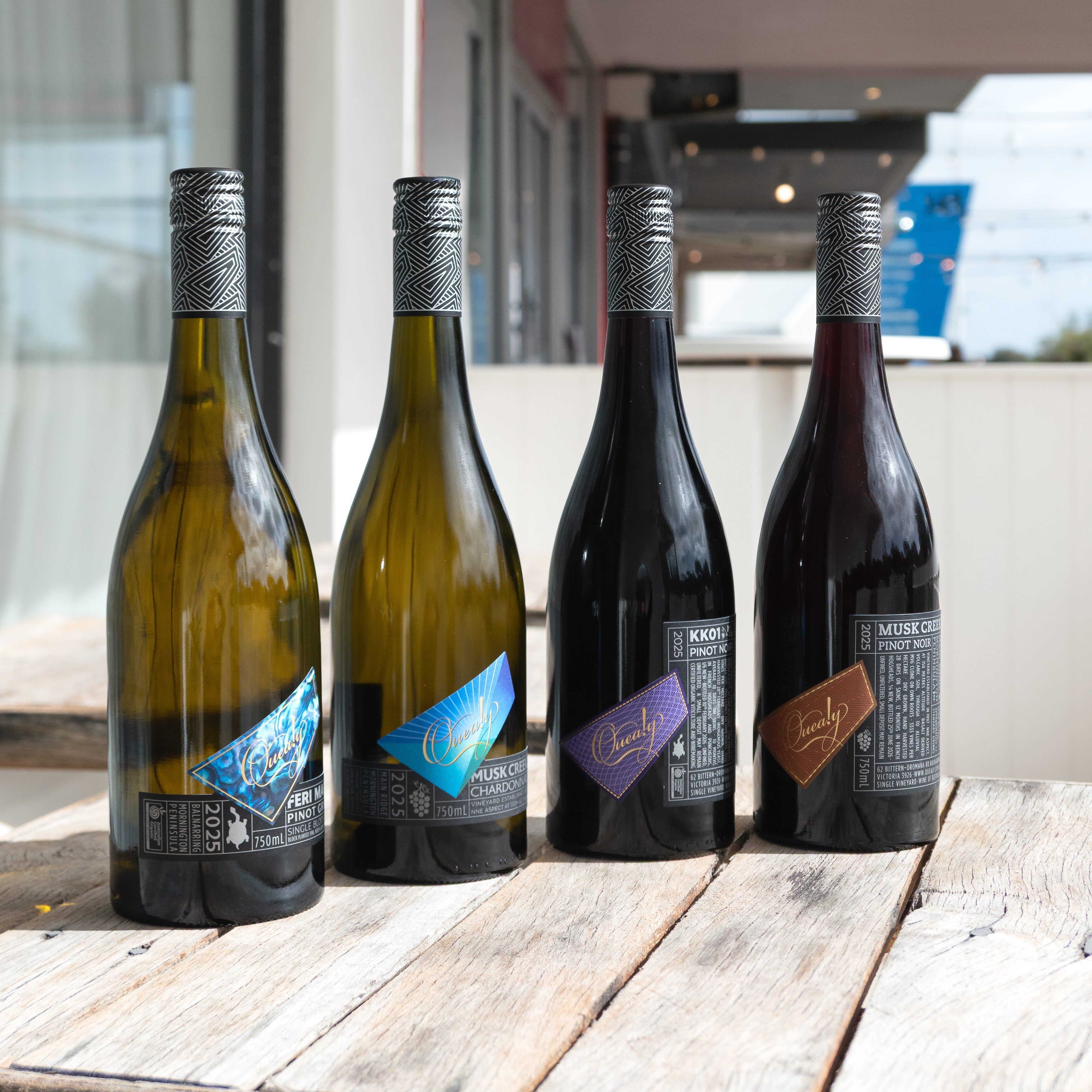 Four bottles of quealy wine: pinot gri, pinot noir, kk01